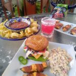 Grilled nacho burgers with a con queso cheese sauce and pico de gallo,