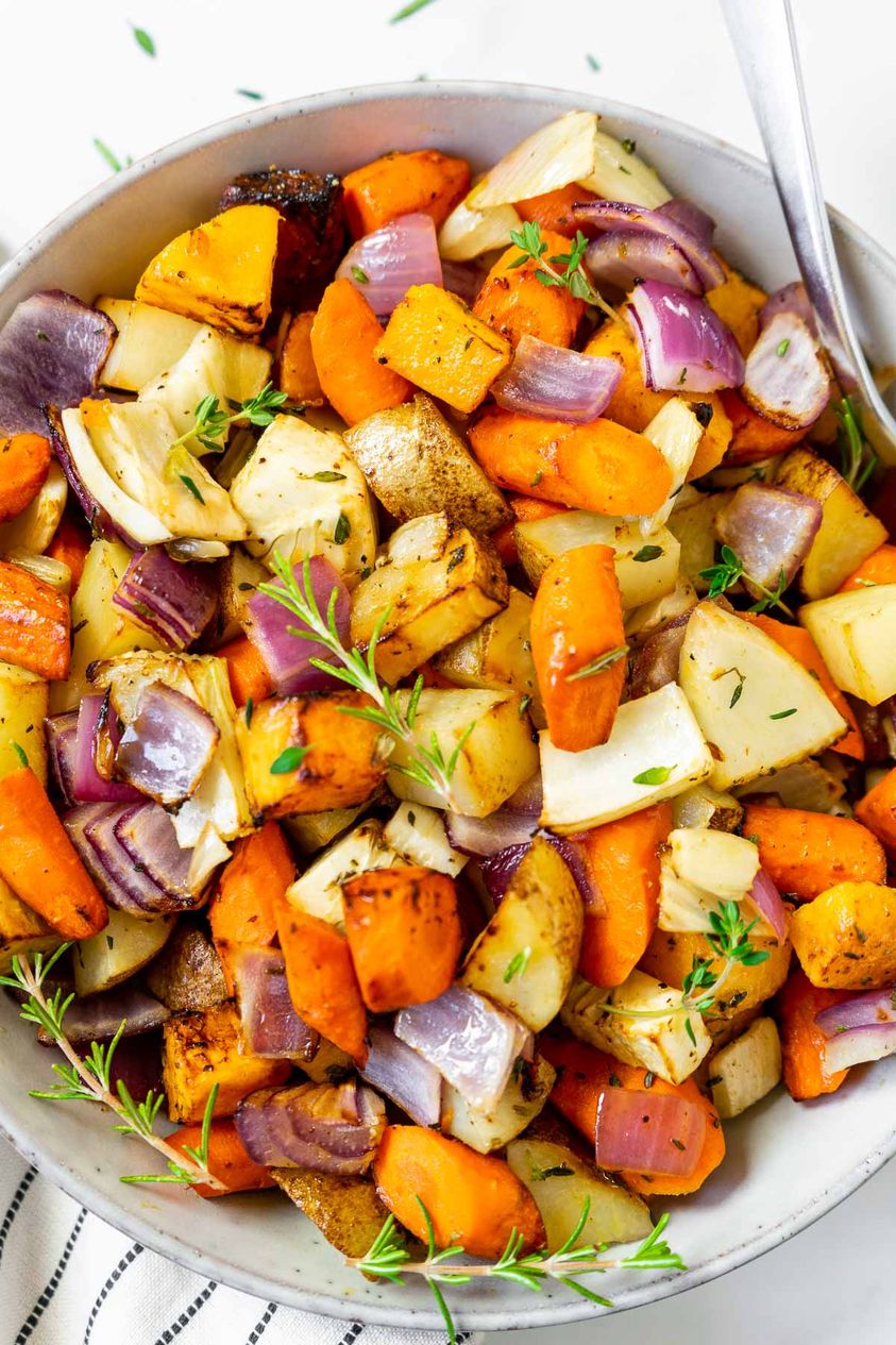 air fryer roasted root vegetables are tossed in olive oil