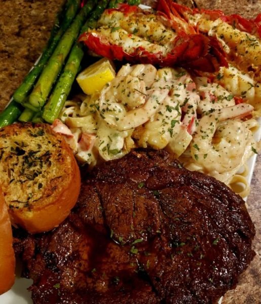 Shrimp pasta,grilled lobster with garlic butter, Ribeye seasoned simply