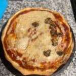 Vegan cheese and half mushroom thin crust pizza