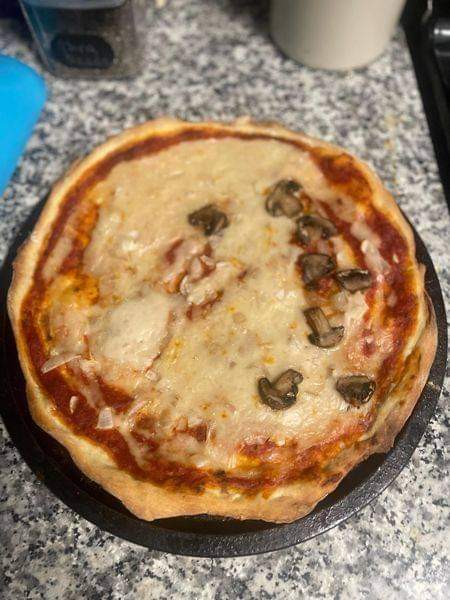 Vegan cheese and half mushroom thin crust pizza