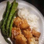 Vegan Orange tofu with jasmine rice and asparagus