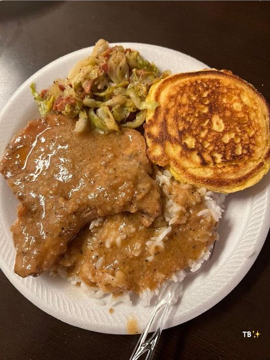 Cabbage, hot water cornbread, smothered pork chops and gravy