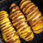 crispy and cheesy hasselback potatoes cooked in the air fryer.