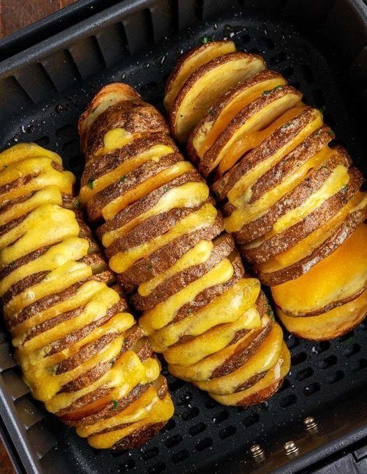 crispy and cheesy hasselback potatoes cooked in the air fryer.