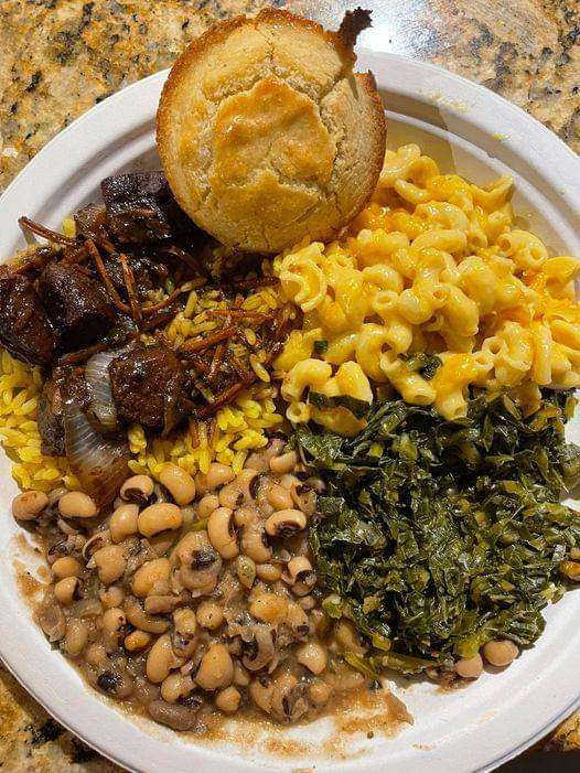 Oxtail with Mac n cheese collard greens black eyed peas