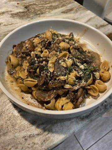 Creamy mushrooms with vegan parmesan