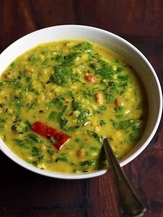 Vegan lentils mixed with spinach leaves