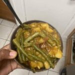 Vegan spicy smothered green beans over rice