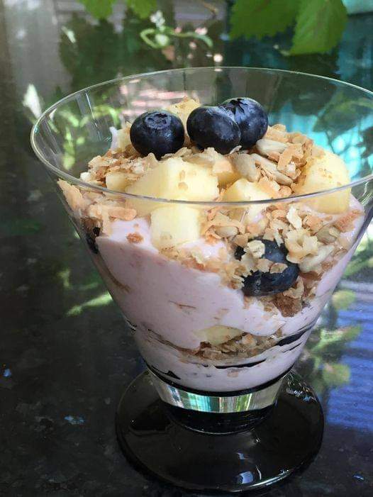 Vegan snack recipe for yogurt topped with fruit and granola