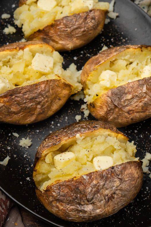 Air Fryer Baked Potato covered with a parsley garlic salt rub